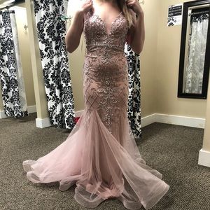 Prom dress- never worn and unaltered. Size 6 but fits more like a 4